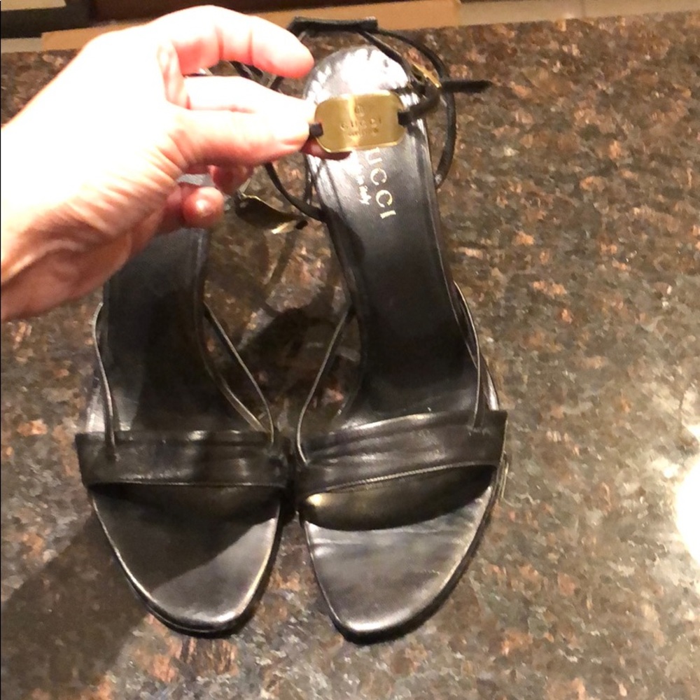 Gucci black leather heels with gold plate